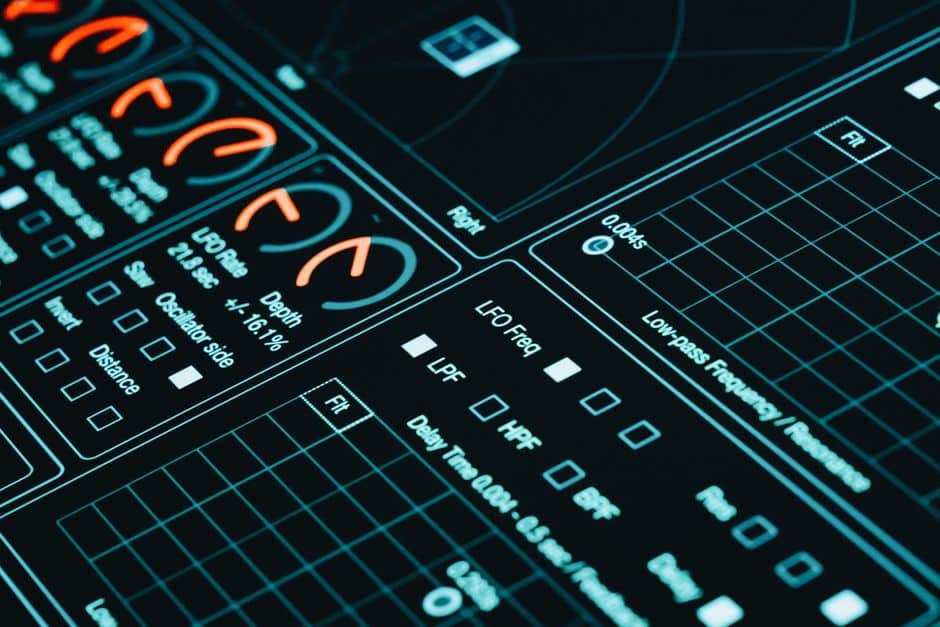 Interface numérique affichant des graphes et indicateurs de données en environnement sombre